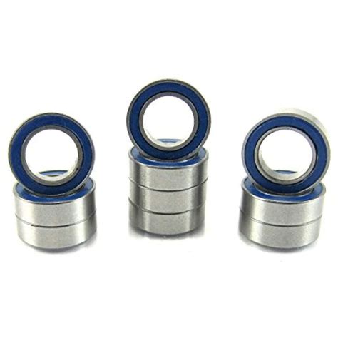 Four Different Sized Bearing Units With Blue Rubber Rings On White