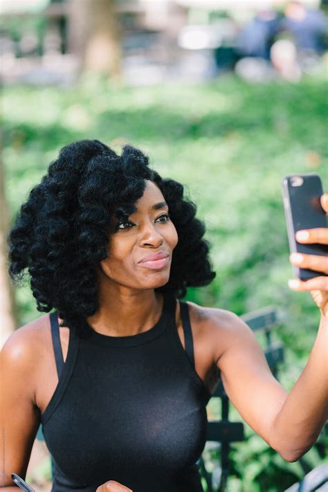 Woman Taking A Selfie At The Park By Stocksy Contributor Vero