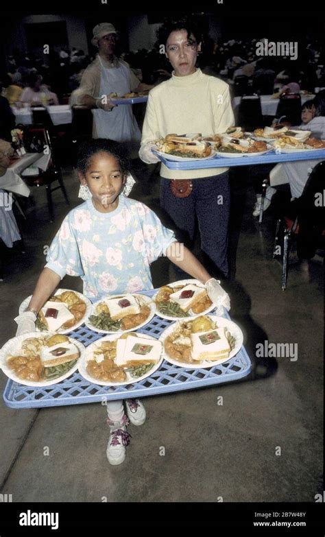 San Antonio, Texas USA, 1990: Volunteers serve up free Thanksgiving meals to hundreds of low ...