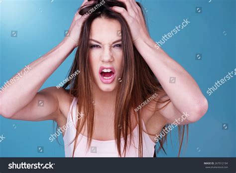 Attractive Young Woman Throwing Temper Tantrum Stock Photo 267012194