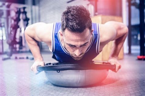 Premium Photo Muscular Man Doing Push Up On Bosu Ball At Crossfit Gym