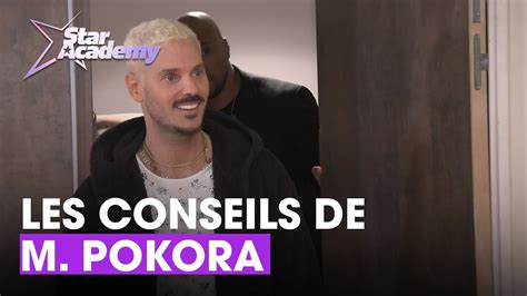 Moment dintimité entre M Pokora et les académiciens après le concert