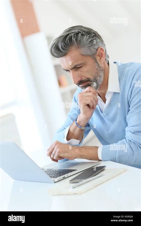 Trendy Mature Man Working From Home With Laptop Stock Photo Alamy
