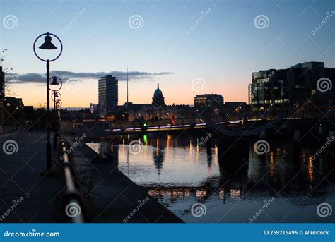 Cityscape View Of Dublin By River Liffey With A Hazy Skyline At Dusk