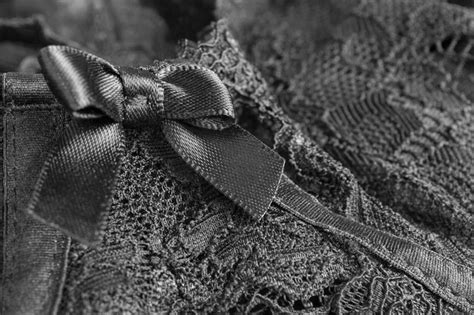 Premium Photo Black Lacy Lingerie With Small Satin Bow Closeup As A Background