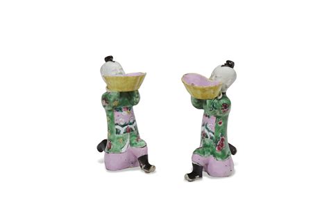 A Pair Of Chinese Export Porcelain Famille Rose Figures Of Kneeling