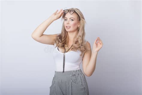 Portrait Of Smiling Beautiful Blonde Woman Looking Camera Stock Photo