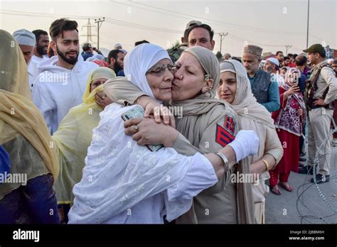 A Police Officer Kisses A Kashmiri Woman As She Leaves For The Annual