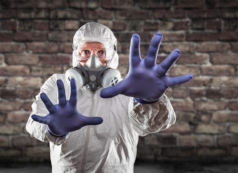 Premium Photo Man Wearing Hazmat Suit Protective Gas Mask And Goggles