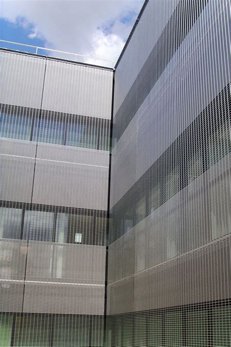 Wire Mesh Facade Cladding With Varying Openings At Hospital St Antoine