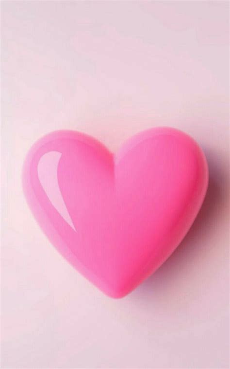 A Pink Heart Shaped Object Sitting On Top Of A Table