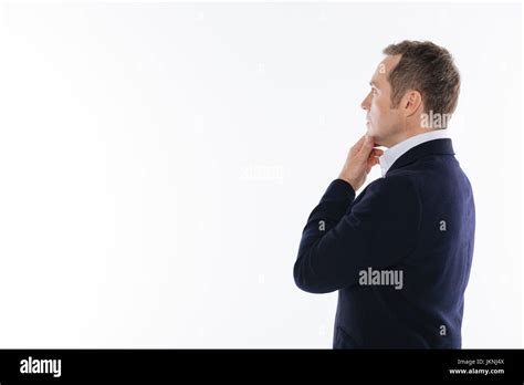 Charming Intelligent Gentleman Acting During The Photoshoot Stock Photo