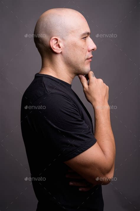 Portrait Of Handsome Bald Man Against Gray Background Stock Photo By