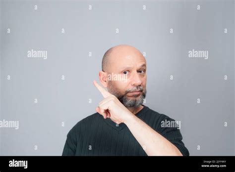 Portrait Of Mature Man Standing On White Background Bald Bearded Man