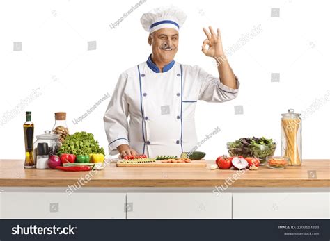 Mature Male Chef Posing Behind Counter Stock Photo 2202114223