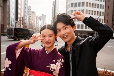 Free Photo Japanese Couple Posing Outdoors And Celebrating Coming Of