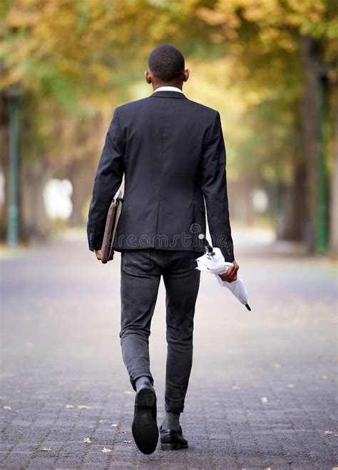Umbrella Nature And Back Of Businessman Walking To Work In City Park