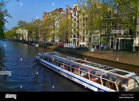 Houses And Bridge Along The Canal Belt Amsterdam Netherlands Stock