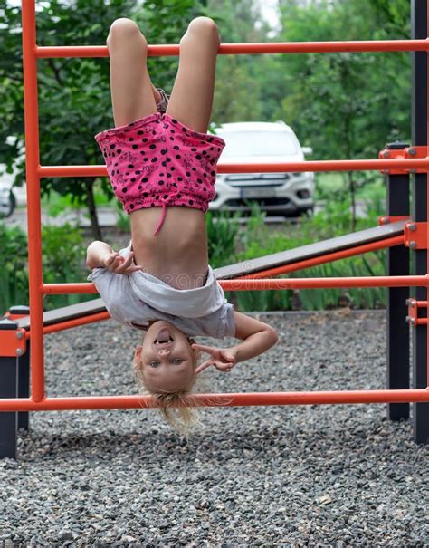 311 Down Girl Playground Upside Stock Photos - Free & Royalty-Free Stock Photos from Dreamstime