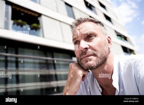 Best Ager Man Thinking In City Stock Photo Alamy