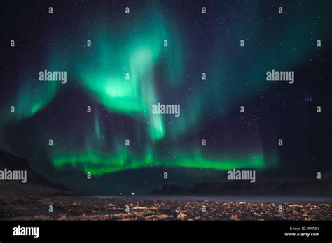 Aurora Borealis Viewed From The Small Arctic Town Of Pangnirtung Over