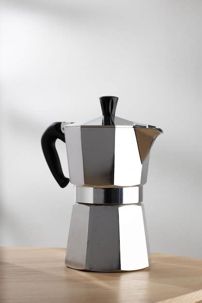 Premium Photo | Moka pot espresso machine on the stove