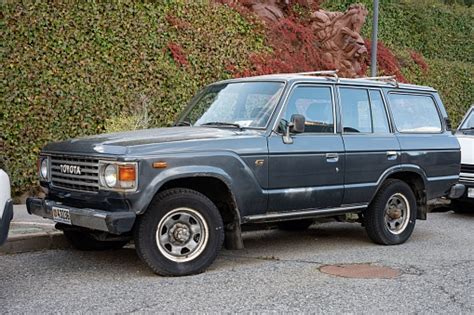 Old Suv Parked On The Street Looks Abandoned Stock Photo - Download ...