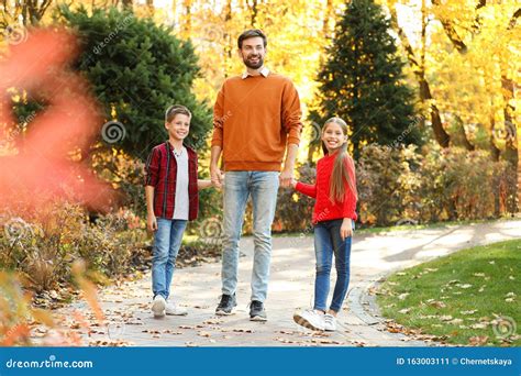 Happy Father with Children Walking in Park Stock Image - Image of ...