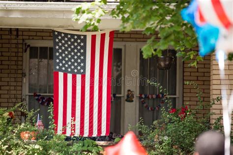 American Flag Hanging Outside of House Stock Photo - Image of july, memorial: 176150138