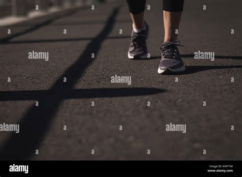 Runner Feet Walking On Road Stock Photo Alamy