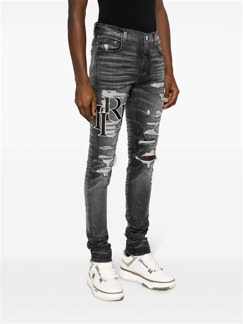 Amiri Logo Print Ripped Skinny Jeans Grey Farfetch Uk