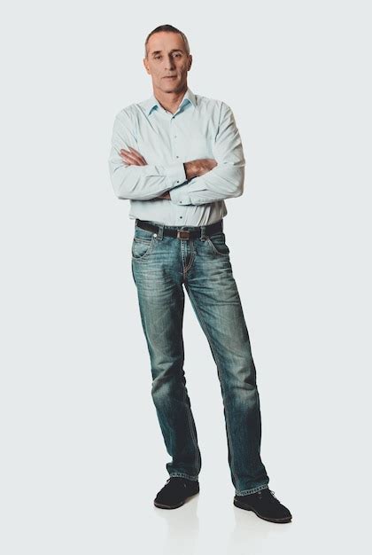 Premium Photo Portrait Of Mature Man Standing Against White Background