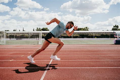 Man Running On Tartan Track Stock Photo