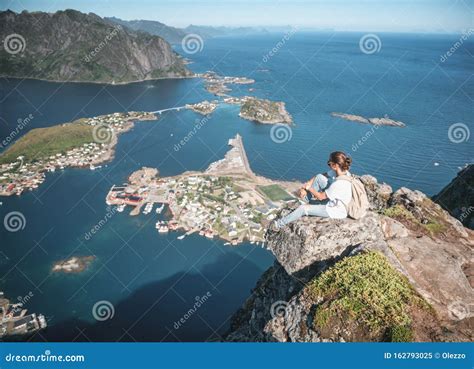 Happy Woman Hiker Enjoying Scenic View at the Top of Reinebringen Hike ...