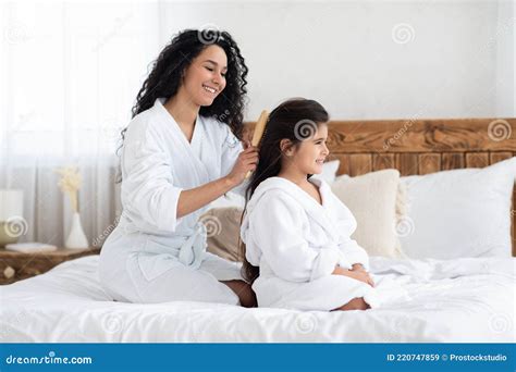 Attractive Young Mother Brushing Her Daughter Hair Stock Image Image