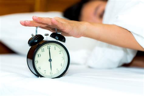 Premium Photo Woman Stop Alarm Clock Ringing In Morning