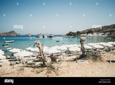 Lindos, Greece - Septemeber 10, 2016: View of the beach town of Lindos, with yachts and blue sea ...