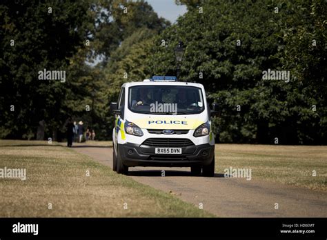 People Enjoying The Warm Weather In Hyde Park London Featuring