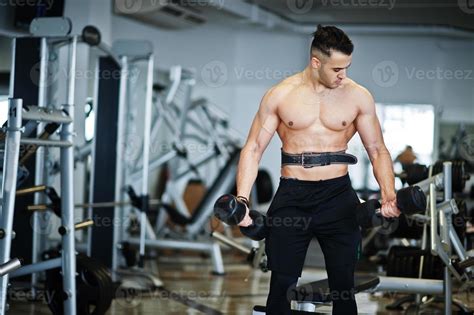 Muscular Arab Man Training In With Dumbbells Modern Gym Fitness Arabian Men With Naked Torso