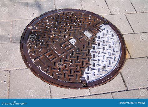 An Old Oxidized Telephone Manhole On A Public Walkaway Stock Image