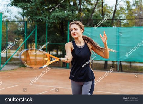 Professional Equipped Female Tennis Player Beating Stock Photo