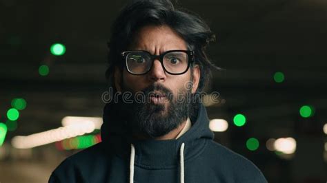 Close Up Indian Shocked Bearded Guy In Glasses Astonished Looking At