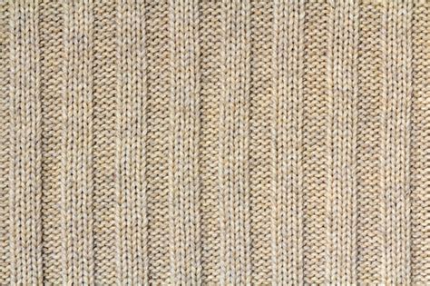 Premium Photo | Background texture of beige pattern knitted fabric made ...