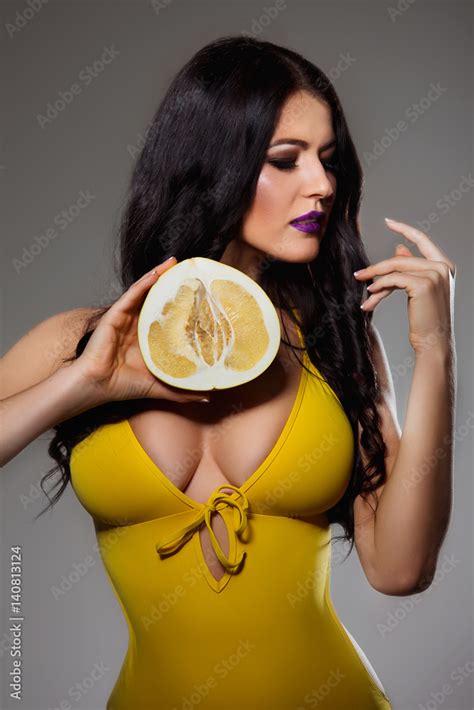 Beautiful Brunette Woman With Perfect Body And Big Breast In Yellow