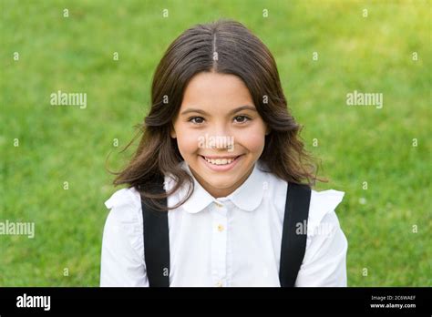 she is so cute. happy childhood. back to school. Small girl wear school uniform. beauty and ...