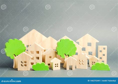 Miniature Wooden Toy Houses And Trees Real Estate Concept