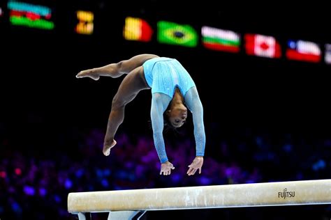 Simone Biles makes history on opening day of qualifying at World ...