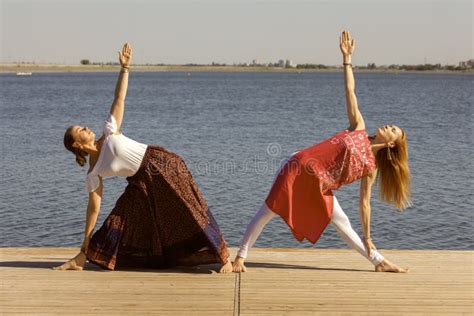 Two Mature Women Keeping Fit by Doing Yoga in the Summer Obraz Stock Obraz złożonej z