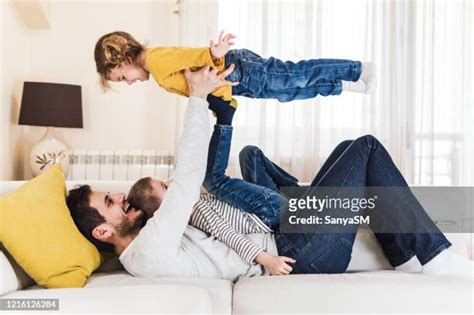 Father Holding Child In Air Photos And Premium High Res Pictures