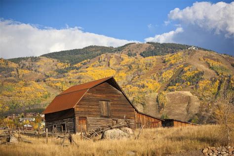 The Famous Steamboat Barn Steamboat Springs Ski Area In The Background With Yellow Aspen Trees